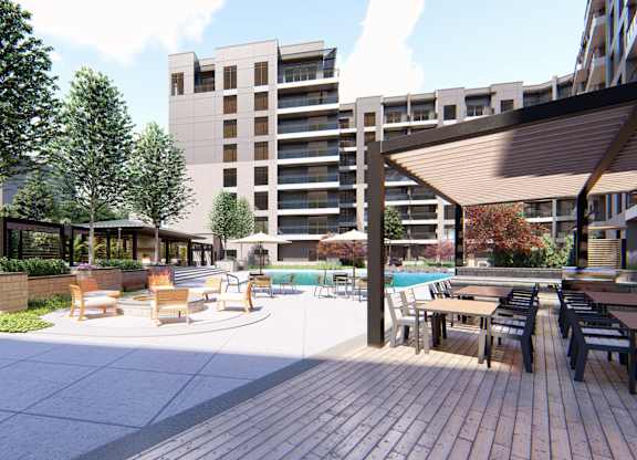 Grilling station and poolside lounge area at Zen City Center Troy, MI