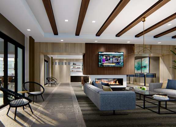 Resident lounge open to the outdoor amenities with tv at Zen City Center Troy, MI