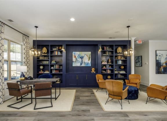 a living room with a table and chairs