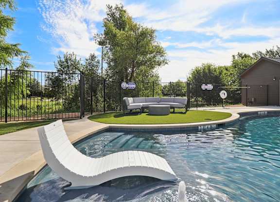 Pool and lounge area at Townhomes at Princeton Meadows, Princeton rental homes