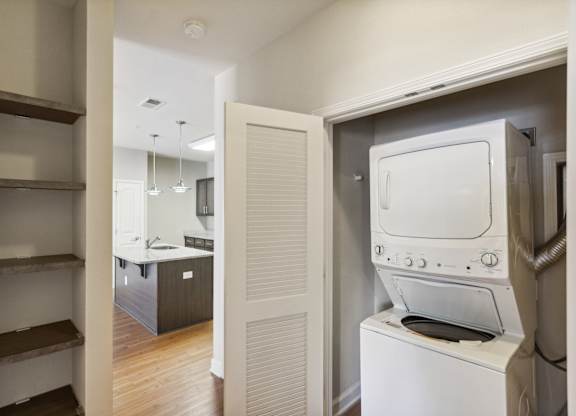 a room with a washer and dryer in it