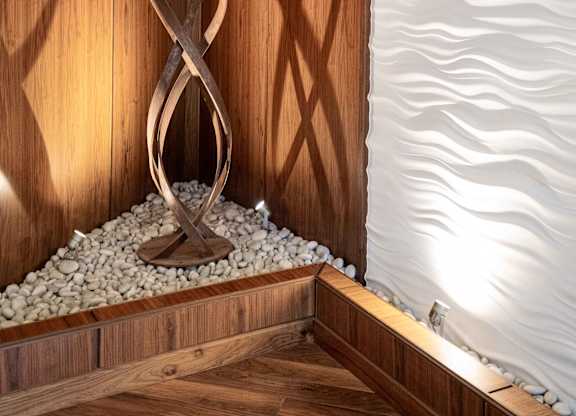 Accent wall in lobby with sculpture