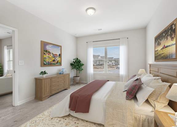 A bedroom with a large bed and a painting on the wall.