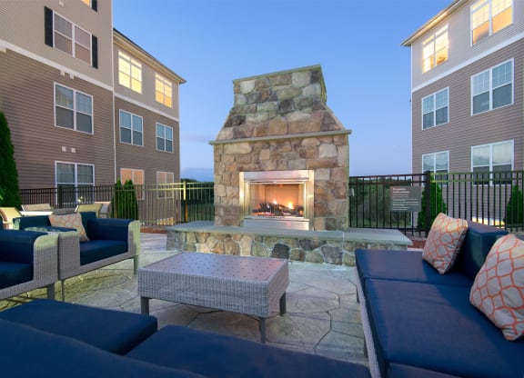 Outdoor fireplace lounge with soft seating