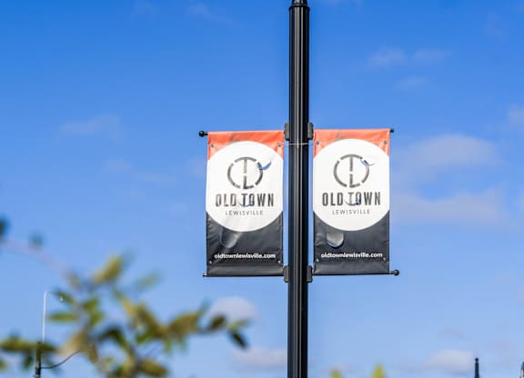 Two Old Town Lewiston banners are displayed on a pole.