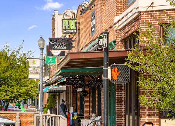A street view of a town with a sign for Old Town Lounge.