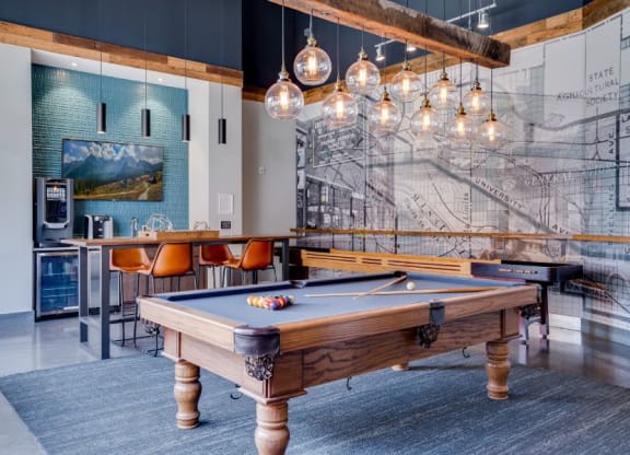Pool table in Lounge with coffee bar and tables C&E Living in St Paul, MN