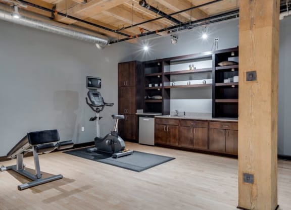 Gym with various cardio equipment C&E Living in St Paul, MN