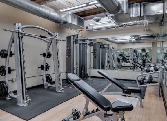 Gym with various weightlifting equipment C&E Living in St Paul, MN