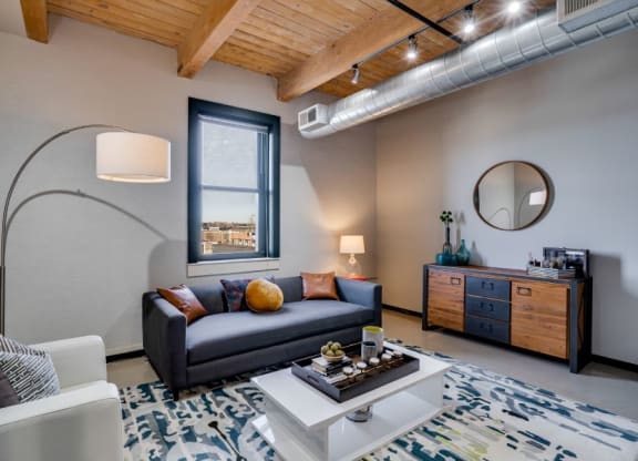 Living room layout with exposed wood beams C&E Living in St Paul, MN