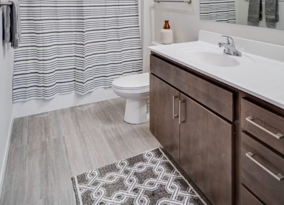 Spacious bathroom with tub/shower combo and vanity top C&E Living in St Paul, MN