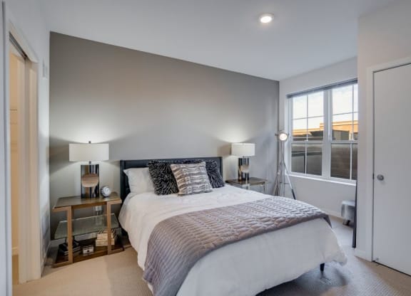 Flats bedroom with open windows C&E Living in St Paul, MN