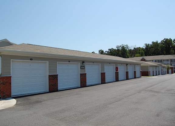 A long row of garage doors are closed.