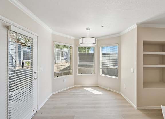 A spacious room with a sliding door and a built-in shelf.