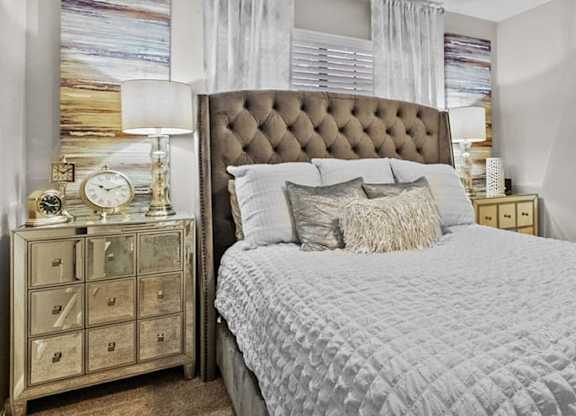 a bedroom with a large bed and a window