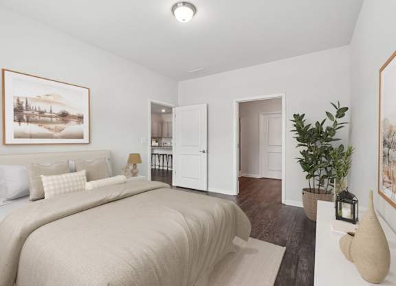 A bedroom with a large bed and a painting on the wall.