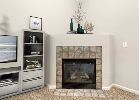A fireplace with a vase and a plant on top of it.