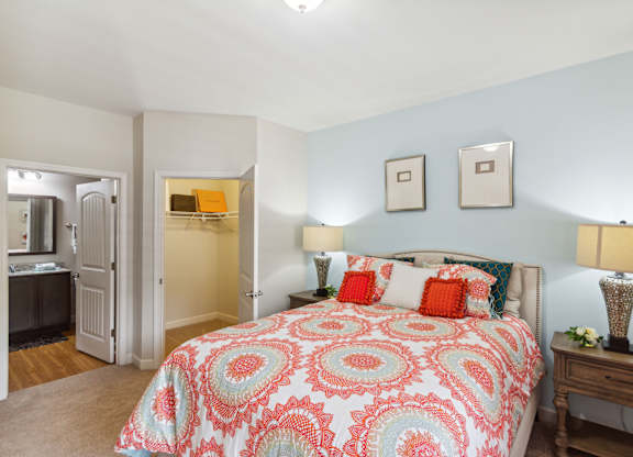 a bedroom with a bed and two night stands