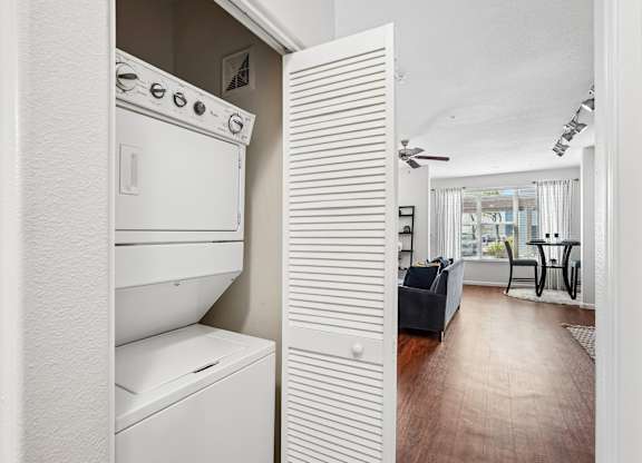 A white oven and dishwasher in a kitchen.