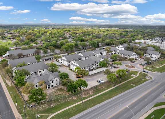 A suburban area with houses and a road.