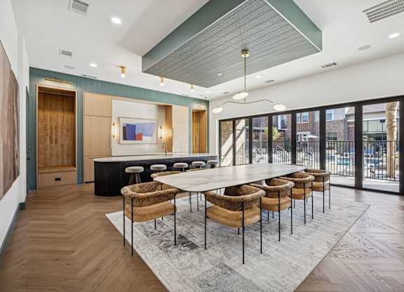 A conference room with a long table and chairs.