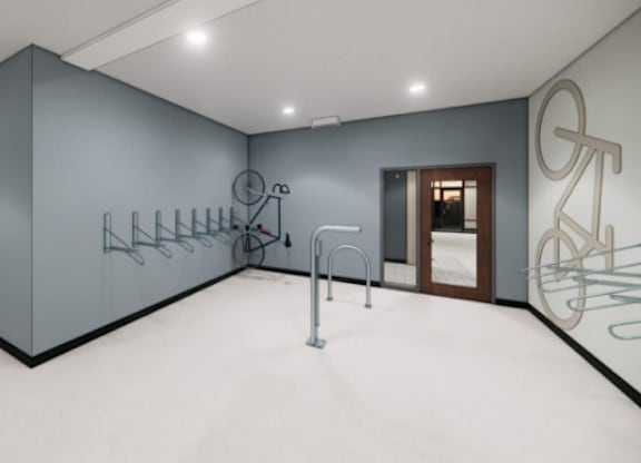 A room with a bicycle drawing on the wall and a rack of bicycles.