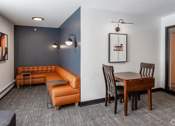 a living room and dining room with furniture and a table