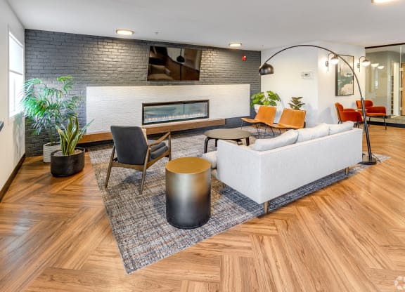 a living room with a couch and a fireplace