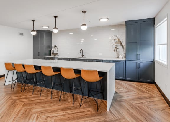 a kitchen with a white counter top and blue cabinets