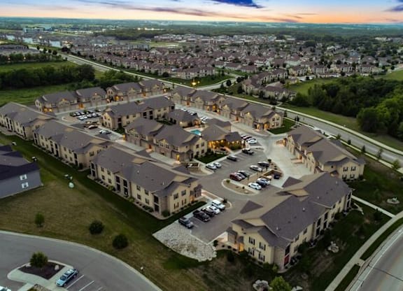 A large housing development with multiple buildings and roads.