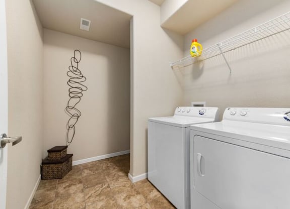 A laundry room with a washer and dryer.