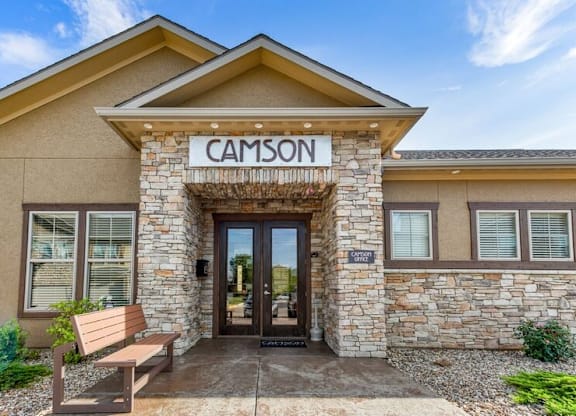 The front of a building with the name "CAMSON" on it.