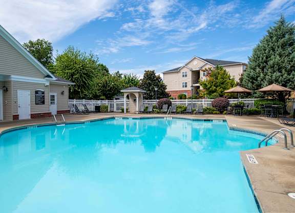 A large swimming pool in a residential area.