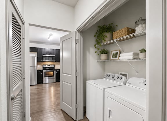 A laundry room with a washer and dryer.
