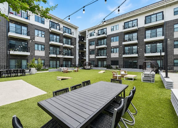 Big green lawn in front of a building at Markethaus 3700 in Plano Texas