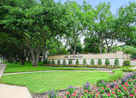 beautifully landscaped monument sign at St Moritz in Dallas Texas