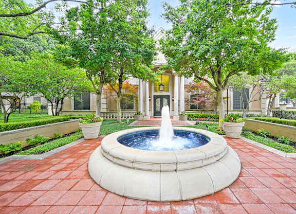 a fountain in a courtyard at St Moritz in Dallas Texas