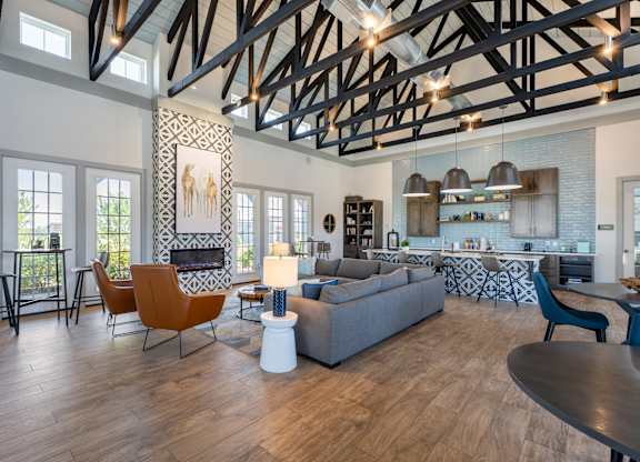 A modern living room with a fireplace and a dining table.