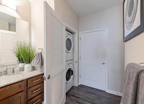 A laundry room with a washer and dryer in it.