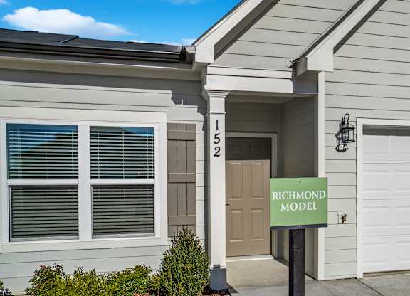 A house with a sign that says Richmond Model.