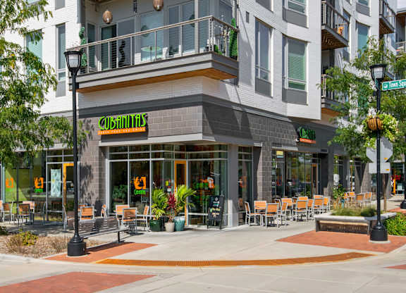 A restaurant named "Cobblestone" is located in a modern building with outdoor seating.