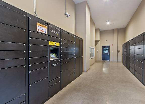 Apartments for Rent Near Camp Springs, MD - Tribeca at Camp Springs - A long hallway with black lockers on both