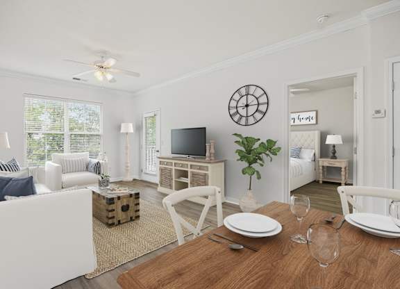 A dining room with a wooden table set for two.