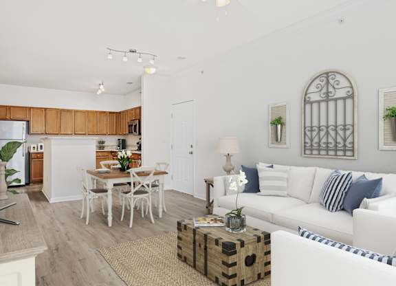A white living room with a dining table and chairs.