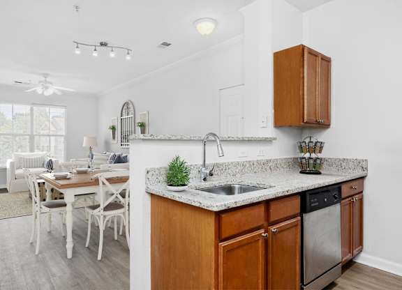 A kitchen with a table and chairs in the dining area.