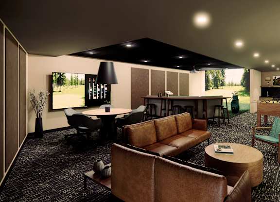 A living room with a brown couch and a black and white rug.