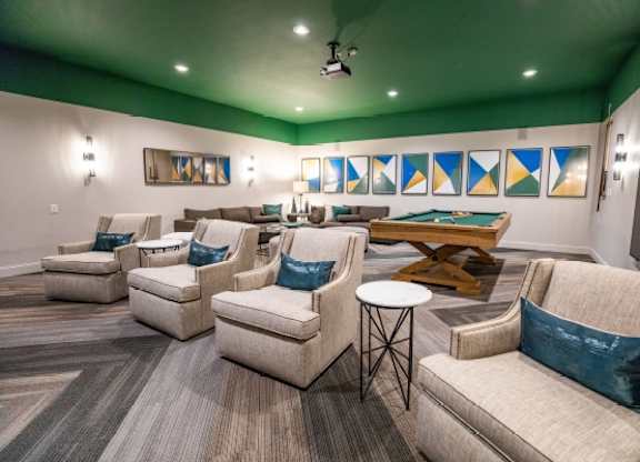 A living room with a green ceiling and a brown sofa.