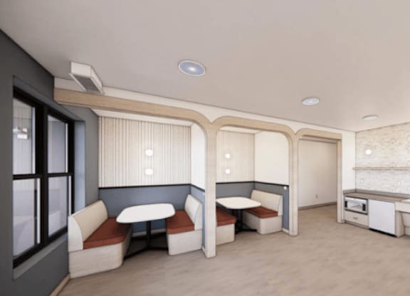 A kitchen area with a sink, stove, and cabinets.