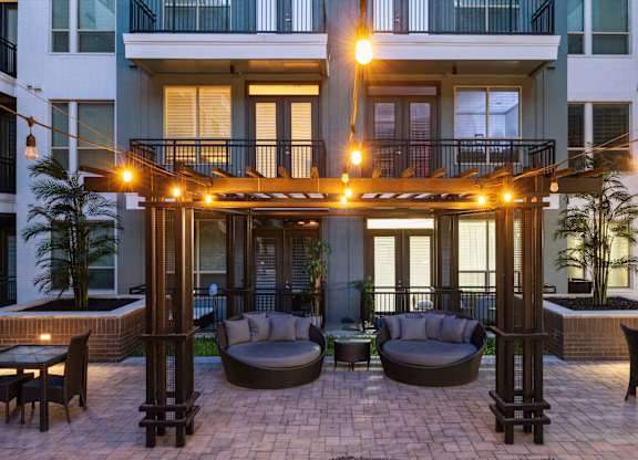 A patio with comfortable furniture at L2 Uptown in Dallas Texas