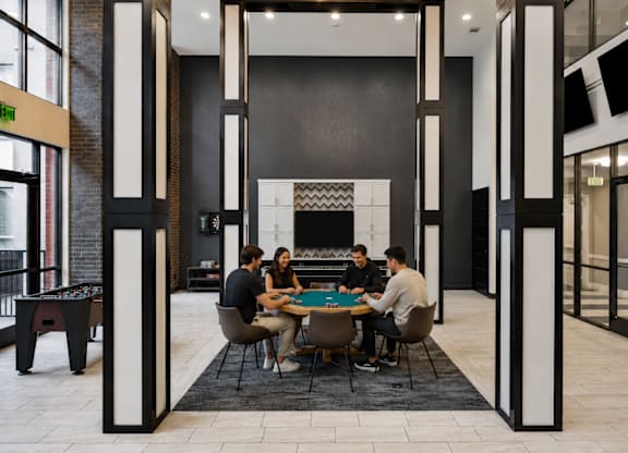 residents playing poker at L2 Uptown in Dallas Texas